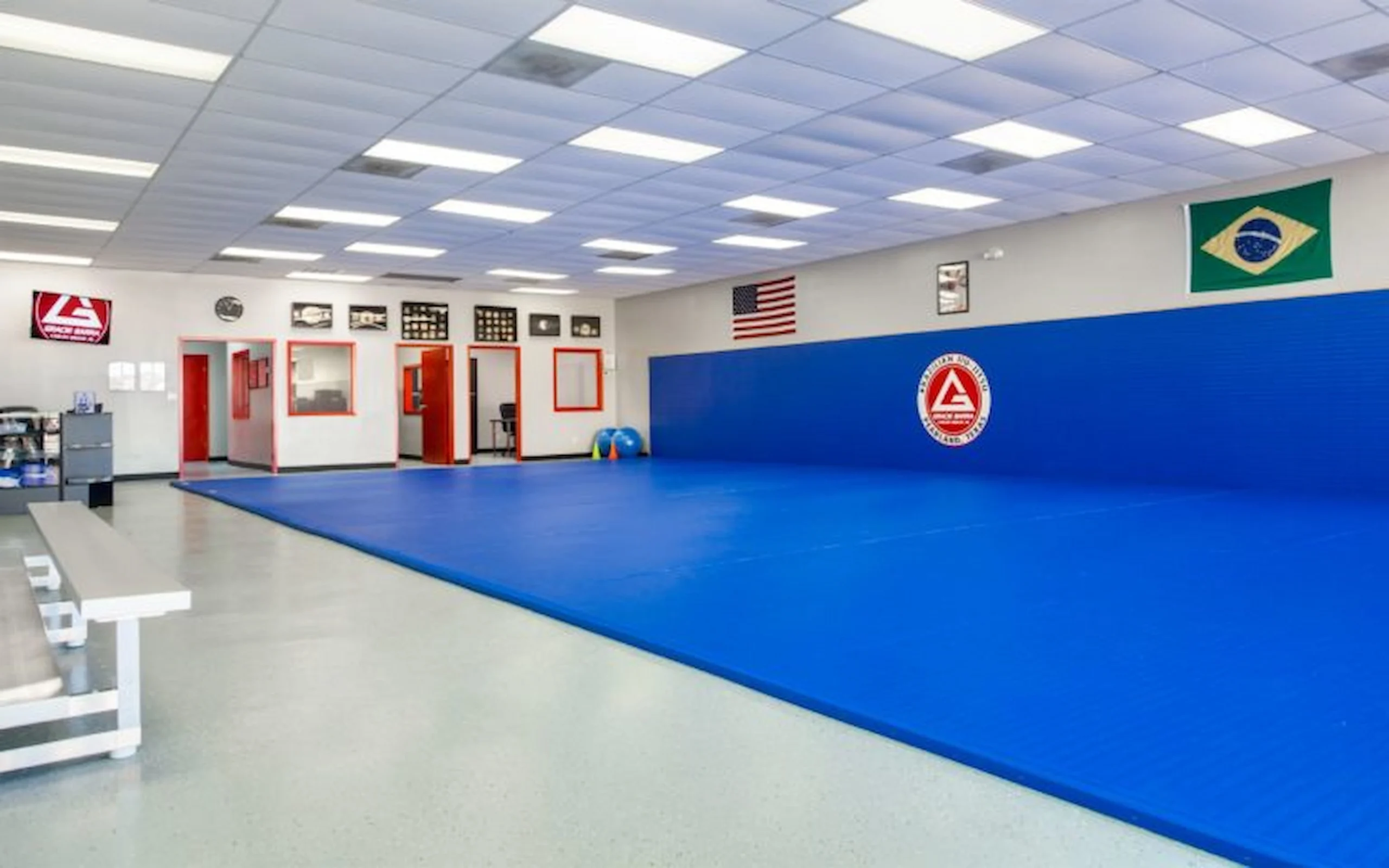 Interior of the Gracie Barra Pearland academy with clean blue Brazilian Jiu-Jitsu training mats